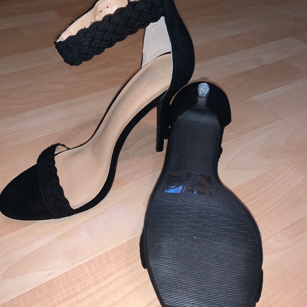 Black heels with braided straps.